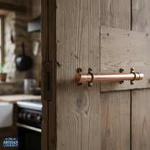 Charger l'image dans la galerie, 22mm / 28mm Copper Pull Handles | Show this handle on old wood door rustic kitchen setting.